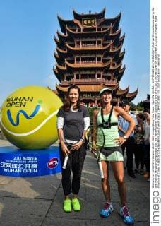 WUHAN, CHINA - SEPTEMBER 28: (CHINA OUT) Retired Chinese tennis star Li Na and Martina Hingis of Switzerland visit the Yellow Grane Tower during day two of the 2015 Wuhan Open on September 28, 2015 in Wuhan, Hubei Province of China.  CFP473573929 