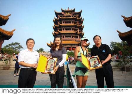 WUHAN, CHINA - SEPTEMBER 28: (CHINA OUT) Retired Chinese tennis star Li Na and Martina Hingis of Switzerland visit the Yellow Grane Tower during day two of the 2015 Wuhan Open on September 28, 2015 in Wuhan, Hubei Province of China.  CFP473573922 
