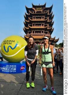 WUHAN, CHINA - SEPTEMBER 28: (CHINA OUT) Retired Chinese tennis star Li Na and Martina Hingis of Switzerland visit the Yellow Grane Tower during day two of the 2015 Wuhan Open on September 28, 2015 in Wuhan, Hubei Province of China.  CFP473573939 