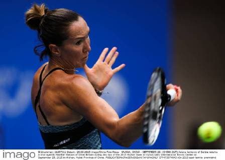 WUHAN, CHINA - SEPTEMBER 28: (CHINA OUT) Jelena Jankovic of Serbia returns a shot against Heather Watson of Great Britain during day two of the 2015 Wuhan Open at Optics Vally International Tennis Center on September 28, 2015 in Wuhan, Hubei Province of China.  CFP473574043 
