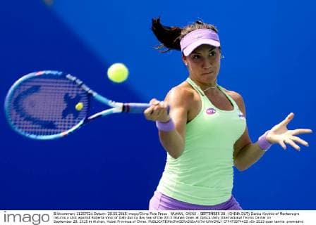 WUHAN, CHINA - SEPTEMBER 28: (CHINA OUT) Danka Kovinic of Montenegro returns a shot against Roberta Vinci of Italy during day two of the 2015 Wuhan Open at Optics Vally International Tennis Center on September 28, 2015 in Wuhan, Hubei Province of China.  CFP473574425 