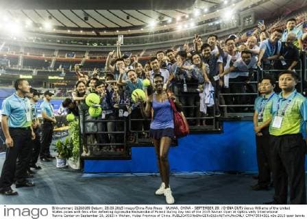 WUHAN, CHINA - SEPTEMBER 28: (CHINA OUT) Venus Williams of the United States poses with fans after defeating Agnieszka Radwanska of Poland during day two of the 2015 Wuhan Open at Optics Vally International Tennis Center on September 28, 2015 in Wuhan, Hubei Province of China.  CFP473594301 