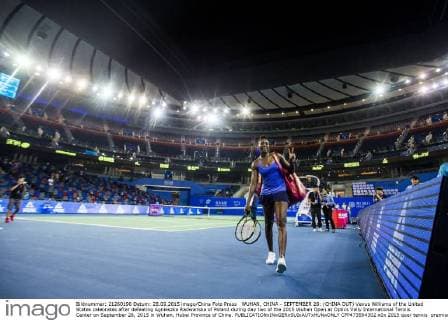 WUHAN, CHINA - SEPTEMBER 28: (CHINA OUT) Venus Williams of the United States celebrates after defeating Agnieszka Radwanska of Poland during day two of the 2015 Wuhan Open at Optics Vally International Tennis Center on September 28, 2015 in Wuhan, Hubei Province of China.  CFP473594302 