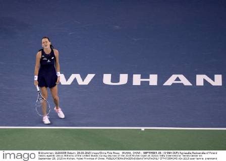 WUHAN, CHINA - SEPTEMBER 28: (CHINA OUT) Agnieszka Radwanska of Poland reacts against Venus Williams of the United States during day two of the 2015 Wuhan Open at Optics Vally International Tennis Center on September 28, 2015 in Wuhan, Hubei Province of China.  CFP473594345 