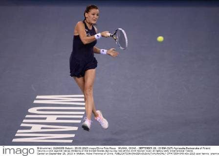 WUHAN, CHINA - SEPTEMBER 28: (CHINA OUT) Agnieszka Radwanska of Poland returns a shot against Venus Williams of the United States during day two of the 2015 Wuhan Open at Optics Vally International Tennis Center on September 28, 2015 in Wuhan, Hubei Province of China.  CFP473594349 