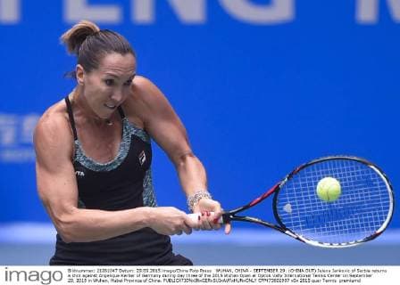 WUHAN, CHINA - SEPTEMBER 29: (CHINA OUT) Jelena Jankovic of Serbia returns a shot against Angelique Kerber of Germany during day three of the 2015 Wuhan Open at Optics Vally International Tennis Center on September 29, 2015 in Wuhan, Hubei Province of China.  CFP473602997 