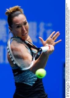 WUHAN, CHINA - SEPTEMBER 29: (CHINA OUT) Jelena Jankovic of Serbia returns a shot against Angelique Kerber of Germany during day three of the 2015 Wuhan Open at Optics Vally International Tennis Center on September 29, 2015 in Wuhan, Hubei Province of China.  CFP473603004 