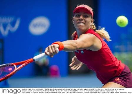 WUHAN, CHINA - SEPTEMBER 29: (CHINA OUT) Angelique Kerber of Germany returns a shot against Jelena Jankovic of Serbia during day three of the 2015 Wuhan Open at Optics Vally International Tennis Center on September 29, 2015 in Wuhan, Hubei Province of China.  CFP473603010 