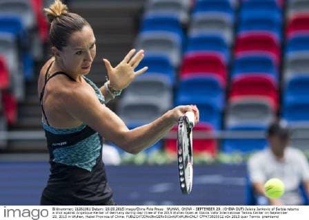 WUHAN, CHINA - SEPTEMBER 29: (CHINA OUT) Jelena Jankovic of Serbia returns a shot against Angelique Kerber of Germany during day three of the 2015 Wuhan Open at Optics Vally International Tennis Center on September 29, 2015 in Wuhan, Hubei Province of China.  CFP473603012 