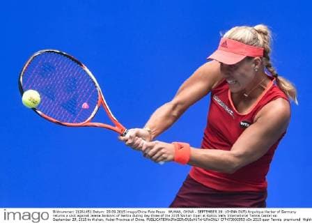 WUHAN, CHINA - SEPTEMBER 29: (CHINA OUT) Angelique Kerber of Germany returns a shot against Jelena Jankovic of Serbia during day three of the 2015 Wuhan Open at Optics Vally International Tennis Center on September 29, 2015 in Wuhan, Hubei Province of China.  CFP473602993 