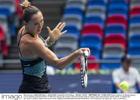 WUHAN, CHINA - SEPTEMBER 29: (CHINA OUT) Jelena Jankovic of Serbia returns a shot against Angelique Kerber of Germany during day three of the 2015 Wuhan Open at Optics Vally International Tennis Center on September 29, 2015 in Wuhan, Hubei Province of China.  CFP473603012 