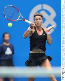 Anna Karolina Schmiedlova of Slovakia returns a shot to Caroline Wozniacki of Denmark in their second-round match of the women s singles during the 2015 WTA Tennis Damen Wuhan Open tennis tournament in Wuhan city, central China s Hubei province, 29 September 2015. Fourth seed Caroline Wozniacki of Denmark lost her second round match to unseeded Anna Karolina Schmiedlova of Slovakia 1-2 (6 1, 4 6, 6 7) in a marathon three hour match during the 2015 Wuhan Open on Tuesday (29 September 2015), further thinning out the ranks of the top seed players at the tournament. Fourth seed Wozniacki knocked out from Wuhan Open  20150929_66949
