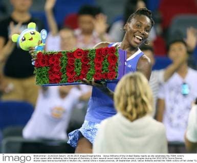 Venus Williams of the United States reacts as she celebrates the 700th victory of her career after defeating Julia Goerges of Germany in their second-round match of the women s singles during the 2015 WTA Tennis Damen Wuhan Open tennis tournament in Wuhan city, central China s Hubei province, 29 September 2015. Venus Williams earned the 700th victory of her career Tuesday (29 September 2015) by beating German qualifier Julia Goerges 6-4, 6-3 in the second round of Wuhan Open. Williams is a seven-time major champion who won her last Grand Slam title at Wimbledon in 2008. Venus Williams wins 700th match of career at Wuhan Open  20150929_67858