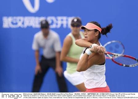 WUHAN, CHINA - SEPTEMBER 29: (CHINA OUT) Xinyun Han (R) of China and Nicole Melichar of America in action during their first round match against Lara Arruabarrena of Spain and Andreja Klepac of Slovakia on day three of the 2015 Wuhan Open at Optics Vally International Tennis Center on September 29, 2015 in Wuhan, Hubei Province of China.  CFP473605054 