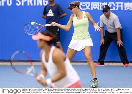 WUHAN, CHINA - SEPTEMBER 29: (CHINA OUT) Xinyun Han (L) of China and Nicole Melichar of America in action during their first round match against Lara Arruabarrena of Spain and Andreja Klepac of Slovakia on day three of the 2015 Wuhan Open at Optics Vally International Tennis Center on September 29, 2015 in Wuhan, Hubei Province of China.  CFP473605053 