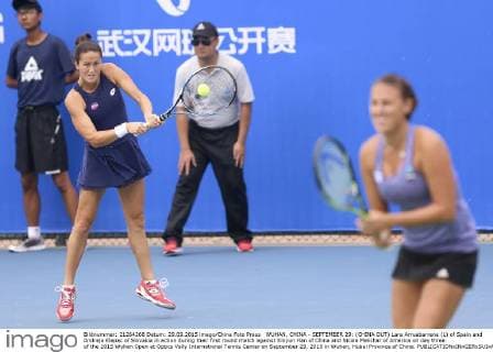 WUHAN, CHINA - SEPTEMBER 29: (CHINA OUT) Lara Arruabarrena (L) of Spain and Andreja Klepac of Slovakia in action during their first round match against Xinyun Han of China and Nicole Melichar of America on day three of the 2015 Wuhan Open at Optics Vally International Tennis Center on September 29, 2015 in Wuhan, Hubei Province of China.  CFP473605058 