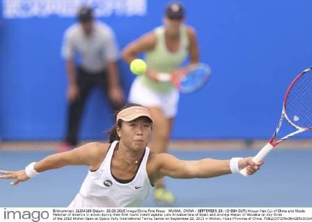 WUHAN, CHINA - SEPTEMBER 29: (CHINA OUT) Xinyun Han (L) of China and Nicole Melichar of America in action during their first round match against Lara Arruabarrena of Spain and Andreja Klepac of Slovakia on day three of the 2015 Wuhan Open at Optics Vally International Tennis Center on September 29, 2015 in Wuhan, Hubei Province of China.  CFP473605059 