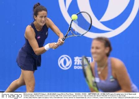 WUHAN, CHINA - SEPTEMBER 29: (CHINA OUT) Lara Arruabarrena (L) of Spain and Andreja Klepac of Slovakia in action during their first round match against Xinyun Han of China and Nicole Melichar of America on day three of the 2015 Wuhan Open at Optics Vally International Tennis Center on September 29, 2015 in Wuhan, Hubei Province of China.  CFP473605063 