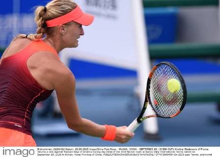 WUHAN, CHINA - SEPTEMBER 29: (CHINA OUT) Kristina Mladenovic of France returns a shot against Madison Keys of America during day three of the 2015 Wuhan Open at Optics Vally International Tennis Center on September 29, 2015 in Wuhan, Hubei Province of China.  CFP473606409 