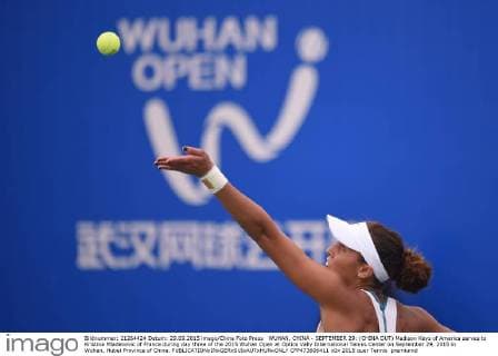 WUHAN, CHINA - SEPTEMBER 29: (CHINA OUT) Madison Keys of America serves to Kristina Mladenovic of France during day three of the 2015 Wuhan Open at Optics Vally International Tennis Center on September 29, 2015 in Wuhan, Hubei Province of China.  CFP473606411 