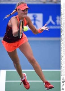 WUHAN, CHINA - SEPTEMBER 29: (CHINA OUT) Kristina Mladenovic of France returns a shot against Madison Keys of America during day three of the 2015 Wuhan Open at Optics Vally International Tennis Center on September 29, 2015 in Wuhan, Hubei Province of China.  CFP473606412 