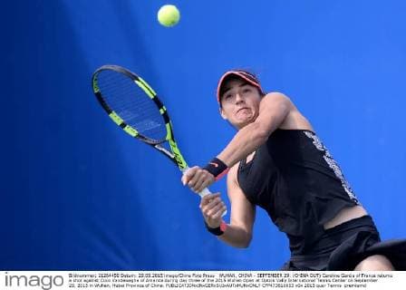 WUHAN, CHINA - SEPTEMBER 29: (CHINA OUT) Caroline Garcia of France returns a shot against Coco Vandeweghe of America during day three of the 2015 Wuhan Open at Optics Vally International Tennis Center on September 29, 2015 in Wuhan, Hubei Province of China.  CFP473610653 