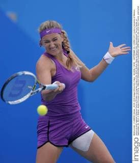 WUHAN, CHINA - SEPTEMBER 29: (CHINA OUT) Victoria Azarenka of Belarus returns a shot against Johanna Konta of Britain during day three of the 2015 Wuhan Open at Optics Vally International Tennis Center on September 29, 2015 in Wuhan, Hubei Province of China.  CFP473610731 