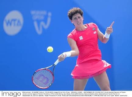 WUHAN, CHINA - SEPTEMBER 29: (CHINA OUT) Carla Suarez Navarro of Spain returns a shot against Monica Niculescu of Romania during day three of the 2015 Wuhan Open at Optics Vally International Tennis Center on September 29, 2015 in Wuhan, Hubei Province of China.  CFP473610908 