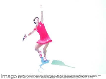 WUHAN, CHINA - SEPTEMBER 29: (CHINA OUT) Carla Suarez Navarro of Spain serves to Monica Niculescu of Romania during day three of the 2015 Wuhan Open at Optics Vally International Tennis Center on September 29, 2015 in Wuhan, Hubei Province of China.  CFP473610910 