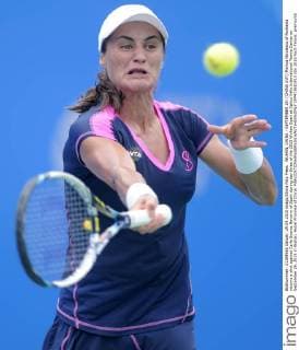 WUHAN, CHINA - SEPTEMBER 29: (CHINA OUT) Monica Niculescu of Romania returns a shot against Carla Suarez Navarro of Spain during day three of the 2015 Wuhan Open at Optics Vally International Tennis Center on September 29, 2015 in Wuhan, Hubei Province of China.  CFP473610913 