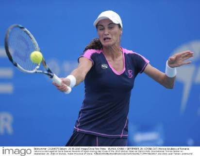 WUHAN, CHINA - SEPTEMBER 29: (CHINA OUT) Monica Niculescu of Romania returns a shot against Carla Suarez Navarro of Spain during day three of the 2015 Wuhan Open at Optics Vally International Tennis Center on September 29, 2015 in Wuhan, Hubei Province of China.  CFP473610917 