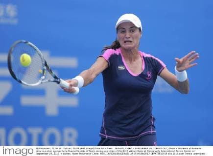 WUHAN, CHINA - SEPTEMBER 29: (CHINA OUT) Monica Niculescu of Romania returns a shot against Carla Suarez Navarro of Spain during day three of the 2015 Wuhan Open at Optics Vally International Tennis Center on September 29, 2015 in Wuhan, Hubei Province of China.  CFP473610919 
