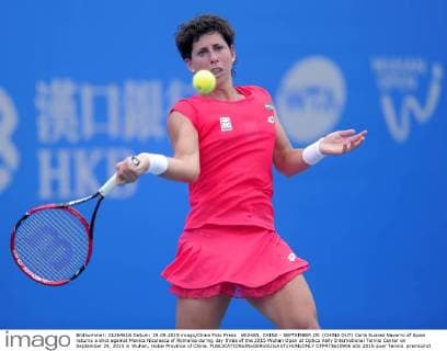 WUHAN, CHINA - SEPTEMBER 29: (CHINA OUT) Carla Suarez Navarro of Spain returns a shot against Monica Niculescu of Romania during day three of the 2015 Wuhan Open at Optics Vally International Tennis Center on September 29, 2015 in Wuhan, Hubei Province of China.  CFP473610906 