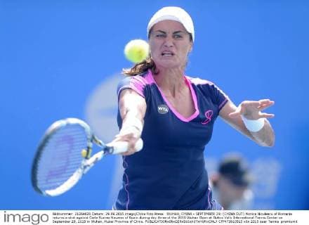 WUHAN, CHINA - SEPTEMBER 29: (CHINA OUT) Monica Niculescu of Romania returns a shot against Carla Suarez Navarro of Spain during day three of the 2015 Wuhan Open at Optics Vally International Tennis Center on September 29, 2015 in Wuhan, Hubei Province of China.  CFP473610915 