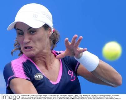 WUHAN, CHINA - SEPTEMBER 29: (CHINA OUT) Monica Niculescu of Romania returns a shot against Carla Suarez Navarro of Spain during day three of the 2015 Wuhan Open at Optics Vally International Tennis Center on September 29, 2015 in Wuhan, Hubei Province of China.  CFP473610918 