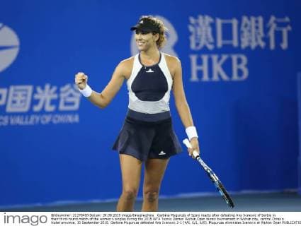 Garbine Muguruza of Spain reacts after defeating Ana Ivanovic of Serbia in their third-round match of the women s singles during the 2015 WTA Tennis Damen Wuhan Open tennis tournament in Wuhan city, central China s Hubei province, 30 September 2015. Garbine Muguruza defeated Ana Ivanovic 2-1 (4 6, 6 1, 6 0). Muguruza eliminates Ivanovic at Wuhan Open  pbu338844_45