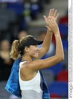 Garbine Muguruza of Spain reacts after defeating Ana Ivanovic of Serbia in their third-round match of the women s singles during the 2015 WTA Tennis Damen Wuhan Open tennis tournament in Wuhan city, central China s Hubei province, 30 September 2015. Garbine Muguruza defeated Ana Ivanovic 2-1 (4 6, 6 1, 6 0). Muguruza eliminates Ivanovic at Wuhan Open  pbu338844_08