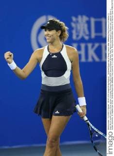 Garbine Muguruza of Spain reacts after defeating Ana Ivanovic of Serbia in their third-round match of the women s singles during the 2015 WTA Tennis Damen Wuhan Open tennis tournament in Wuhan city, central China s Hubei province, 30 September 2015. Garbine Muguruza defeated Ana Ivanovic 2-1 (4 6, 6 1, 6 0). Muguruza eliminates Ivanovic at Wuhan Open  pbu338844_10