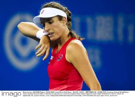 WUHAN, CHINA - SEPTEMBER 30: (CHINA OUT) Johanna Konta of Great Britain reacts against Simona Halep of Romania during day four of 2015 Dongfeng Motor Wuhan Open at Optics Valley International Tennis Center on September 30, 2015 in Wuhan, China.  CFP473664953 