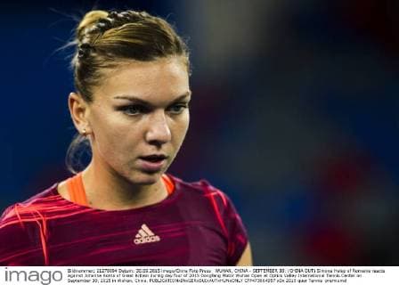 WUHAN, CHINA - SEPTEMBER 30: (CHINA OUT) Simona Halep of Romania reacts against Johanna Konta of Great Britain during day four of 2015 Dongfeng Motor Wuhan Open at Optics Valley International Tennis Center on September 30, 2015 in Wuhan, China.  CFP473664957 