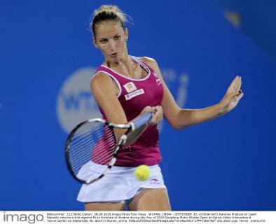 WUHAN, CHINA - SEPTEMBER 30: (CHINA OUT) Karolina Pliskova of Czech Republic returns a shot against Elina Svitolina of Ukraine during day four of 2015 Dongfeng Motor Wuhan Open at Optics Valley International Tennis Center on September 30, 2015 in Wuhan, China.  CFP473667667 