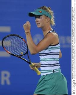 WUHAN, CHINA - SEPTEMBER 30: (CHINA OUT) Elina Svitolina of Ukraine celebrates in the match against Karolina Pliskova of Czech Republic during day four of 2015 Dongfeng Motor Wuhan Open at Optics Valley International Tennis Center on September 30, 2015 in Wuhan, China.  CFP473667669 