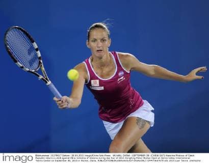 WUHAN, CHINA - SEPTEMBER 30: (CHINA OUT) Karolina Pliskova of Czech Republic returns a shot against Elina Svitolina of Ukraine during day four of 2015 Dongfeng Motor Wuhan Open at Optics Valley International Tennis Center on September 30, 2015 in Wuhan, China.  CFP473667678 