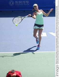Martina Hingis of Switzerland returns a shot as she and Sania Mirza of India compete against Anastasia Rodionova of Russia and Klaudia Jans-Ignacik of Poland in their match of the women s doubles during the 2015 WTA Tennis Damen Wuhan Open tennis tournament in Wuhan city, central China s Hubei province, 1 October 2015. Martina Hingis Sania Mirza defeated Anastasia Rodionova Klaudia Jans-Ignacik 2-0. Hingis Mirza knock out Rodionova Jans-Ignacik at Wuhan Open  20151001_64008