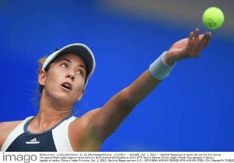 (151001) -- WUHAN, Oct. 1, 2015 -- Garbine Muguruza of Spain serves the ball during her quarterfinal match against Anna Karolina Schmiedlova of Slovakia at 2015 WTA Tennis Damen Wuhan Open Tennis Tournament in Wuhan, capital of central China s Hubei Province, Oct. 1, 2015. Garbine Muguruza won 2-0.) (SP)CHINA-WUHAN-TENNIS-WTA-WUHAN OPEN (CN) ChengxMin 