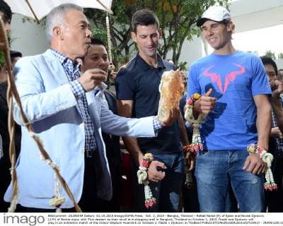 Oct. 1, 2015 - Bangko, Thailand - Rafael Nadal (R) of Spain and Novak Djokovic (2-R) of Serbia enjoy with Thai dessert as their stroll at a shopping mall in Bangkok, Thailand on October 1, 2015. Nadal and Djokovic will play in an exhibition match at the Indoor Stadium Huamark on October 2. Nadal v Djokovic in Thailand  - ZUMAn230
