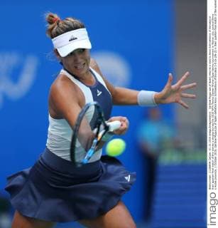 Garbine Muguruza of Spain returns a shot to Anna Schmiedlova of Slovakia in their quarter-final match of the women s singles during the 2015 WTA Tennis Damen Wuhan Open tennis tournament in Wuhan city, central China s Hubei province, 1 October 2015. Garbine Muguruza of Spain defeated Anna Schmiedlova of Slovakia 2-0 (6-2 6-2) in their quarter-final match of the women s singles during the 2015 WTA Wuhan Open tennis tournament in Wuhan city, central China s Hubei province, on Thursday (1 October 2015). Garbine Muguruza beats Anna Schmiedlova to advance at Wuhan Open  pbu339413_05