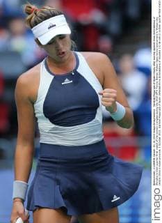 Garbine Muguruza of Spain reacts after scoring against Anna Schmiedlova of Slovakia in their quarter-final match of the women s singles during the 2015 WTA Tennis Damen Wuhan Open tennis tournament in Wuhan city, central China s Hubei province, 1 October 2015. Garbine Muguruza of Spain defeated Anna Schmiedlova of Slovakia 2-0 (6-2 6-2) in their quarter-final match of the women s singles during the 2015 WTA Wuhan Open tennis tournament in Wuhan city, central China s Hubei province, on Thursday (1 October 2015). Garbine Muguruza beats Anna Schmiedlova to advance at Wuhan Open  pbu339413_09