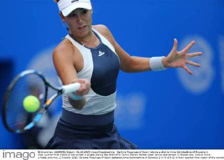 Garbine Muguruza of Spain returns a shot to Anna Schmiedlova of Slovakia in their quarter-final match of the women s singles during the 2015 WTA Tennis Damen Wuhan Open tennis tournament in Wuhan city, central China s Hubei province, 1 October 2015. Garbine Muguruza of Spain defeated Anna Schmiedlova of Slovakia 2-0 (6-2 6-2) in their quarter-final match of the women s singles during the 2015 WTA Wuhan Open tennis tournament in Wuhan city, central China s Hubei province, on Thursday (1 October 2015). Garbine Muguruza beats Anna Schmiedlova to advance at Wuhan Open  pbu339423_08