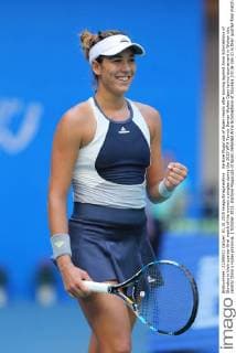Garbine Muguruza of Spain reacts after scoring against Anna Schmiedlova of Slovakia in their quarter-final match of the women s singles during the 2015 WTA Tennis Damen Wuhan Open tennis tournament in Wuhan city, central China s Hubei province, 1 October 2015. Garbine Muguruza of Spain defeated Anna Schmiedlova of Slovakia 2-0 (6-2 6-2) in their quarter-final match of the women s singles during the 2015 WTA Wuhan Open tennis tournament in Wuhan city, central China s Hubei province, on Thursday (1 October 2015). Garbine Muguruza beats Anna Schmiedlova to advance at Wuhan Open  pbu339428_06